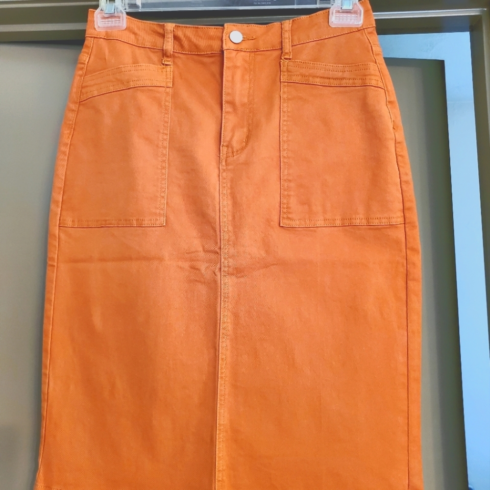 Brand new, adorable denim knee length skirt in Rust, size Medium